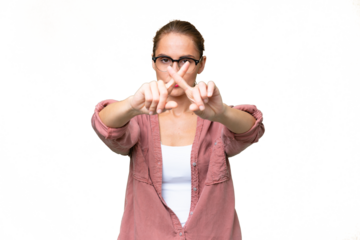 Young caucasian woman over isolated background making stop gesture with her hand to stop an act