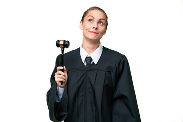 Judge caucasian woman over isolated background and looking up