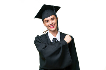Young university graduate  caucasian woman over isolated background celebrating a victory