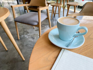 Still life, business, office supplies or education concept : Top view image of open notebook with blank pages and coffee cup on wooden background, ready for adding or mock up