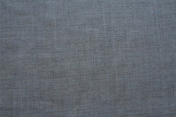 Plakat Fabric texture background. Gray fabric with weave. Natural slightly wrinkled look of the material. Uniform copy space background. Cotton, canvas or woolen thin fabric laid evenly on the surface.