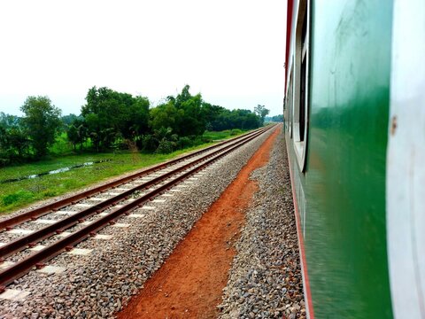 train on station beside village