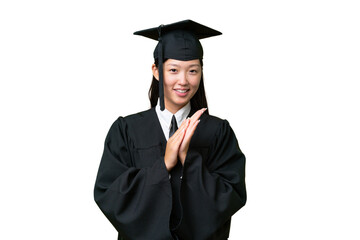 Young university graduate Asian woman over isolated background applauding after presentation in a conference