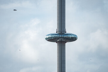 British Airways i360 observation deck in Brighton, UK. Beautiful tower with tourists exploring Brighton by the sea with an amazing view.