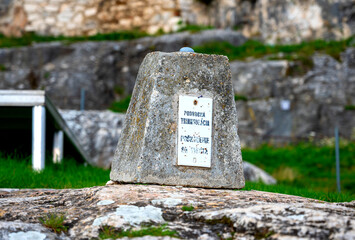old triangulation point on a stone at the Spiš Castle in Slovakia - obrazy, fototapety, plakaty