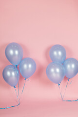 A pink backdrop with blue purple lavender balloons for a backdrop birthday celebration