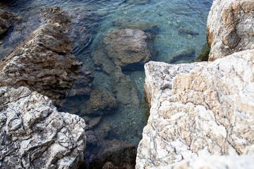 Rocks and stones in the sea. Sea stones. Rough stone surface texture
