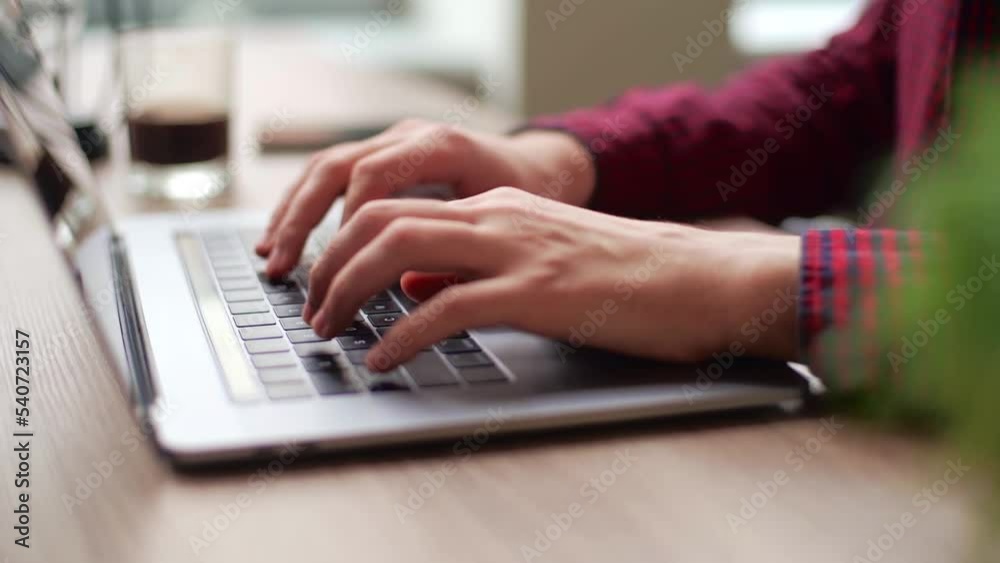 Wall mural close up of freelancer's developer hands typing program code on laptop keyboard in coworking. busine