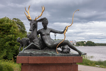 Sweden, Stockholm - July 16, 2022: The Resting Diana bronze statue on red marble pedestal along...