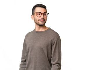 Young handsome caucasian man over isolated background . Portrait