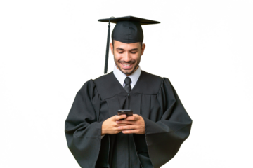 Young university graduate man over isolated background sending a message with the mobile