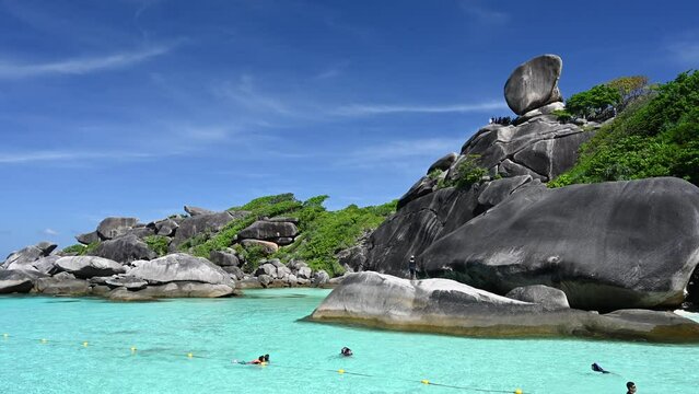 Tropical islands view of ocean blue sea water and white sand beach at Similan Islands with famous Sail Rock, Phang Nga Thailand nature landscape