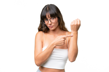 Young caucasian woman over isolated background making the gesture of being late