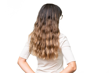 Young caucasian woman over isolated background in back position and looking back