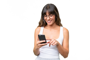 Young caucasian woman over isolated background sending a message or email with the mobile