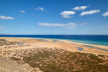 View over a wide beautiful bathing bay on the Canary Island Fuerteventura in the Atlantic Ocean