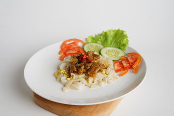 Kwetiau Siram Daging Sapi, Shiny Fresh Kwetiau as White Chinese noodles made from Rice. Popular in South East Asia 