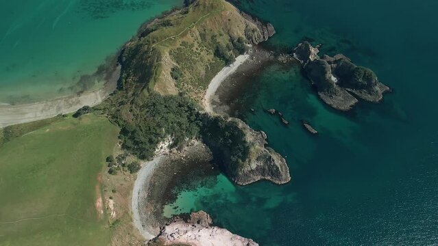 Aerial drone flight over Cray fish bay along the East coast of New Zealand on a clear summers day