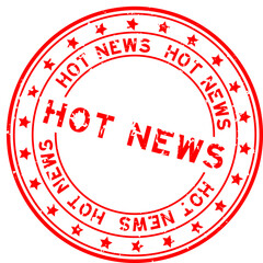 Grunge red hot news word round rubber seal stamp on white background