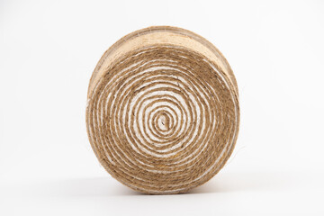 close-up of brown jute twine for DIY and gift wrapping, isolated on white background, concept of zero waste or sustainable lifestyle.