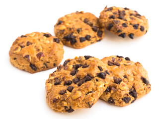 cookies with chocolate and hazelnuts on a white background