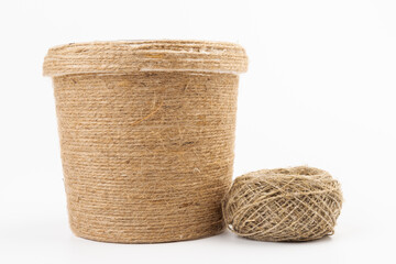 close-up of brown jute twine for DIY and gift wrapping, isolated on white background, concept of zero waste or sustainable lifestyle.