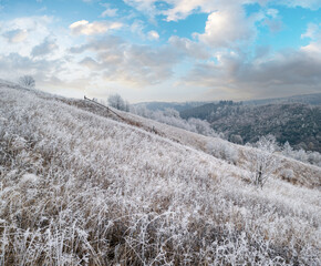 Winter coming. Cloudy and foggy morning very late autumn mountains scene. Peaceful picturesque traveling, seasonal, nature and countryside beauty concept scene. Carpathian Mountains, Ukraine.