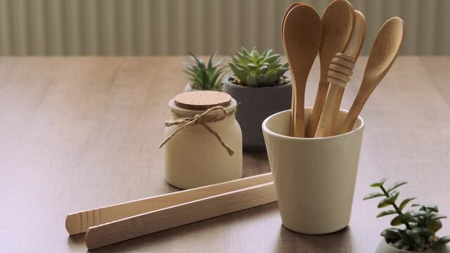 Tableware from natural materials,putting bamboo wooden spoons into cup, zero waste eco friendly concept
