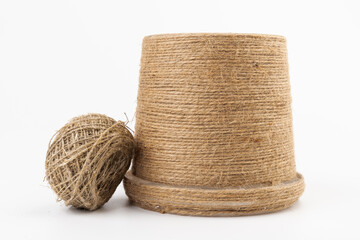 close-up of brown jute twine for DIY and gift wrapping, isolated on white background, concept of zero waste or sustainable lifestyle.