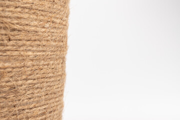 close-up of brown jute twine for DIY and gift wrapping, isolated on white background, concept of zero waste or sustainable lifestyle.