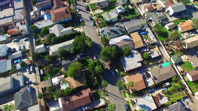 Aerial: Aerial Shot Of Roofed Residential Houses In City, Drone Flying Forward On Sunny Day - Long Beach, California