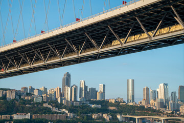 Rail bridge and urban skyline, Chongqing, China