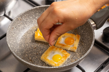 Quail eggs sandwiches in the stone frying pan