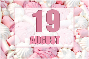 calendar date on the background of white and pink marshmallows. August 19 is the twenty-second day...