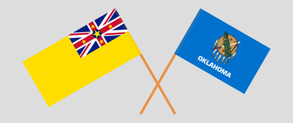 Crossed flags of Niue and The State of Oklahoma. Official colors. Correct proportion