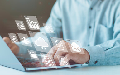 Businessmen use a computer to document management concepts, online documentation databases, digital...