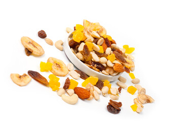 Fruit and nut assortment of peanuts, raisins, pineapple, almonds, cashews and bananas.