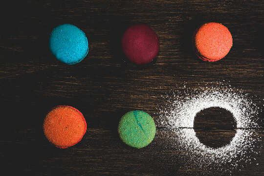 Sweet colorful macaroons on dark background