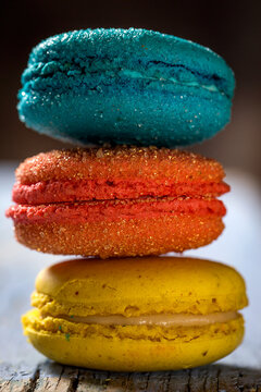 Sweet colorful macaroons on dark background