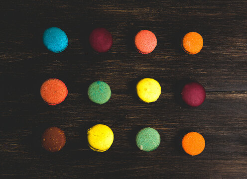Sweet colorful macaroons on dark background