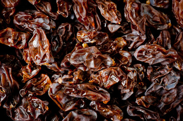 Close-up shot of freshly dried dark-colored raisins.