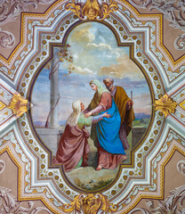 DOMODOSSOLA, ITALY - JULY 19, 2022: The neo-baroque fresco of Visitation on the ceiling of church Santuario Madonna della Neve by unknown artist.