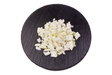Sliced cut fresh onion on black rustick stone plate on white background