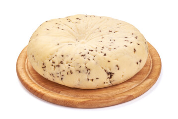 Piece of fresh Cheese with Cumin Seeds, close-up, isolated on white background