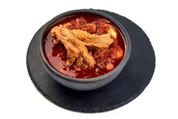 Traditional Ukrainian borsch. Bowl of red beet root soup borsch, isolated on white background.
