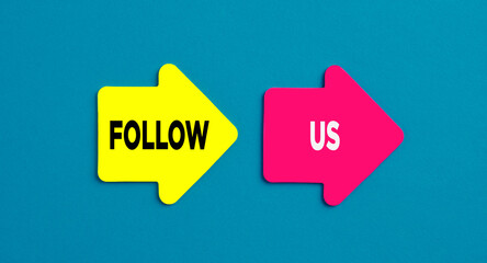 Follow us concept. The word follow us on arrow shaped stickers
