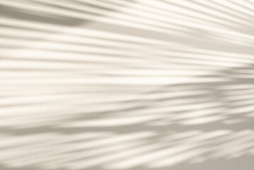 Abstract geometric shadows on grey, gold or yellow natural material wall., background. Sunny warm background