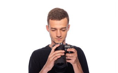 Young man with a DSLR camera on a white background.