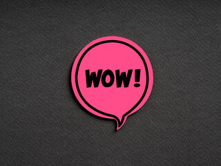 The word WOW on pink speech bubble on black background. Amazement, admiration, surprise or...