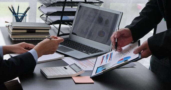 Marketing Financial analyst analysis business financial report on digital tablet during discussion at meeting of corporate showing the results of their successful teamwork., business meeting concept,	